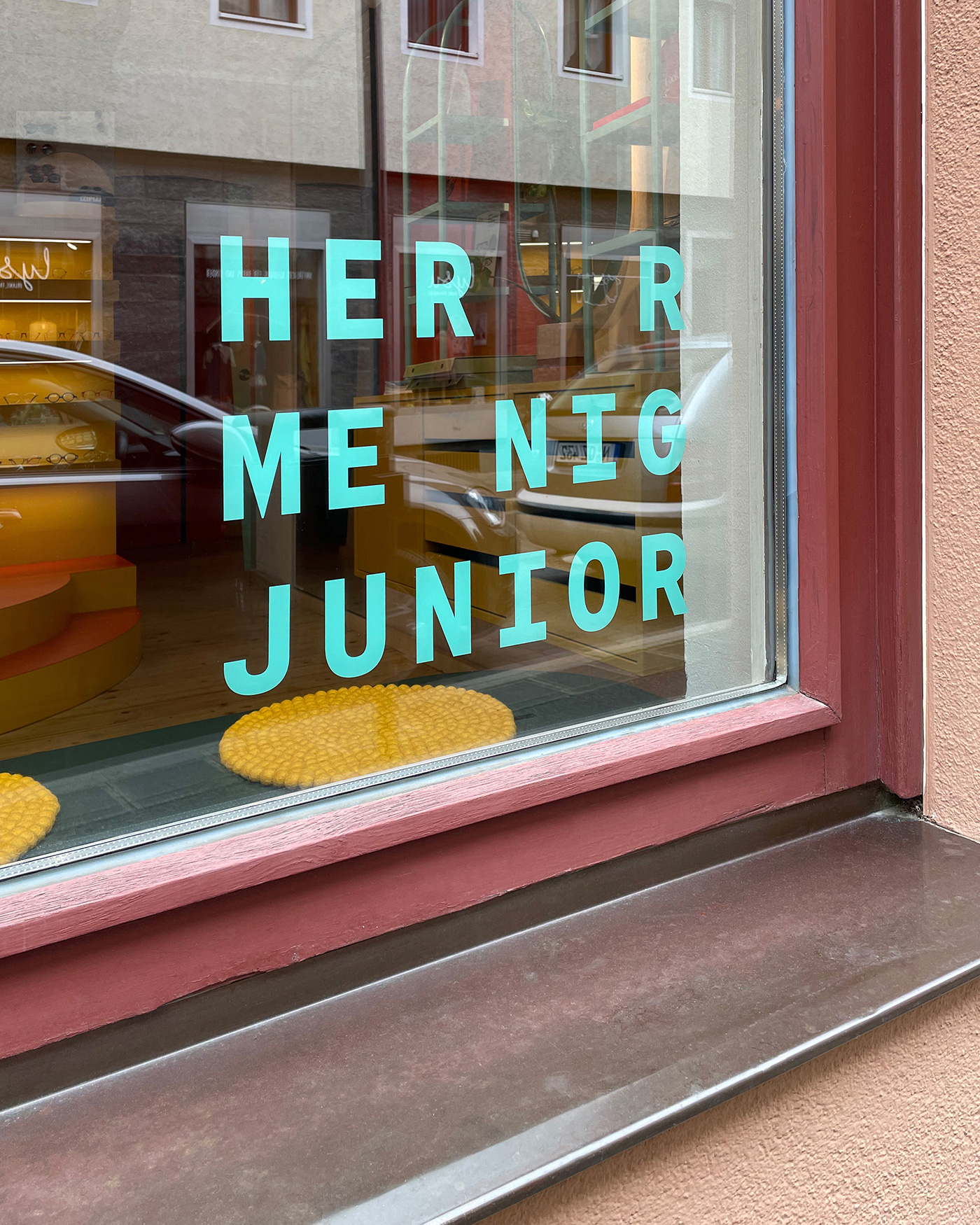 Herr Menig Junior signage window sticker